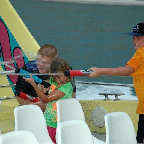 a group of people on a boat in the water