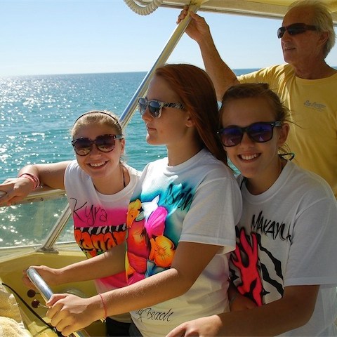 a group of people on a boat in the water