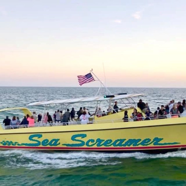 a group of people on a boat in the water